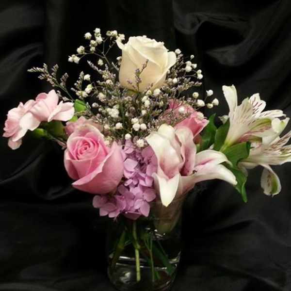 Pink and white bouquet in a glass vase