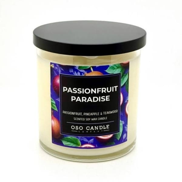 Scented candle in a glass jar with a black lid