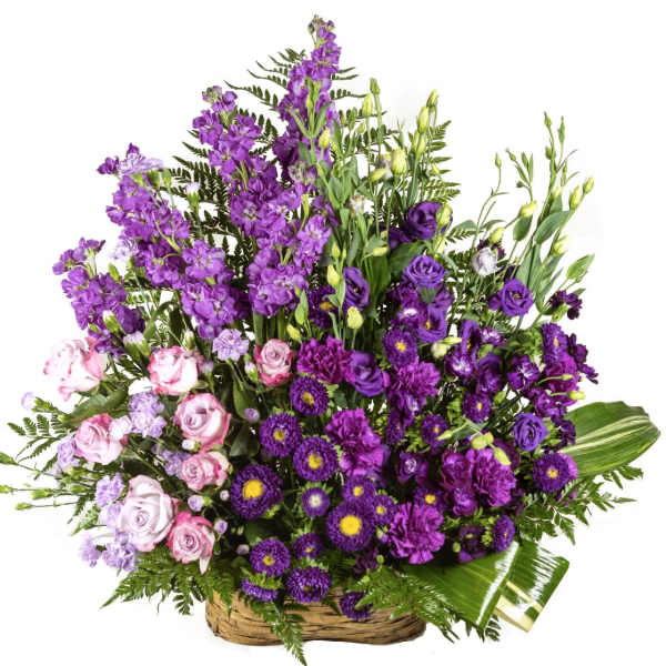 Large basket arrangement of purple and pink flowers