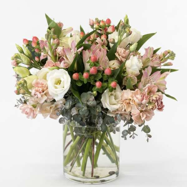 Mixed pink and white bouquet in a clear glass vase