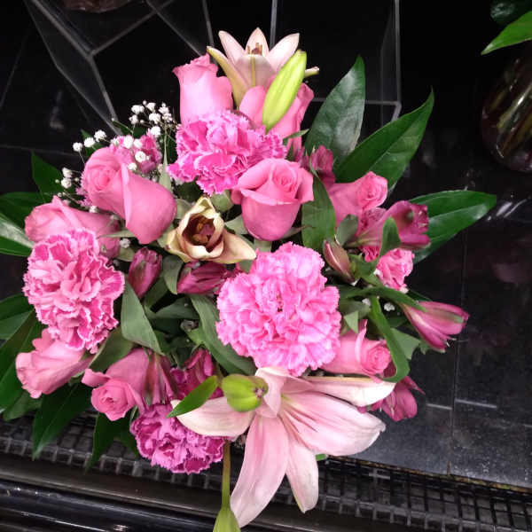 Pink bouquet with roses, lilies, and carnations