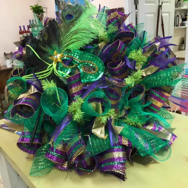 Decorative Mardi Gras wreath with green, purple, and gold mesh ribbons