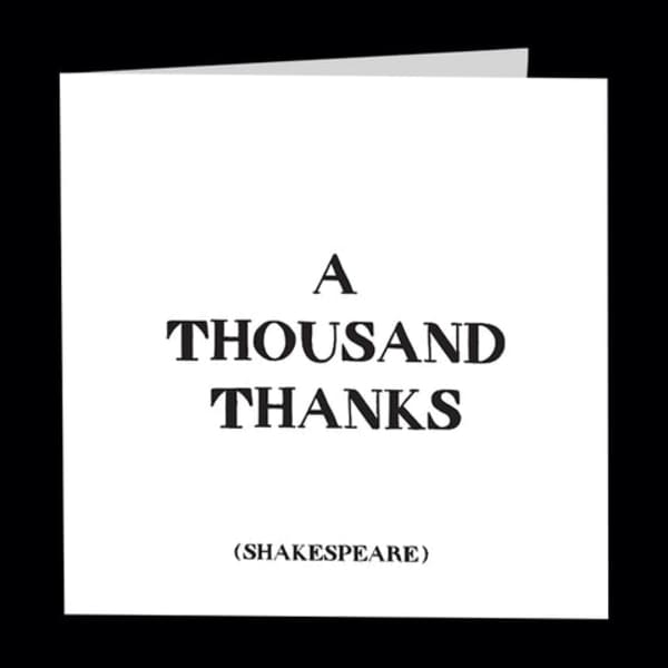 White thank-you card with the words A THOUSAND THANKS