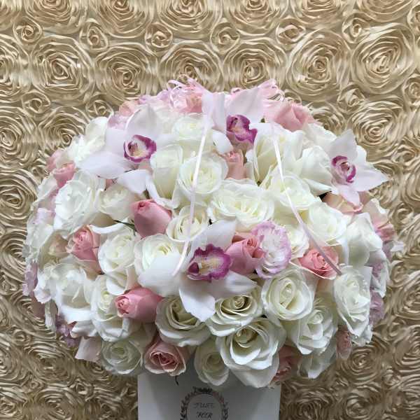 Pink and white rose bouquet with orchids in a white box