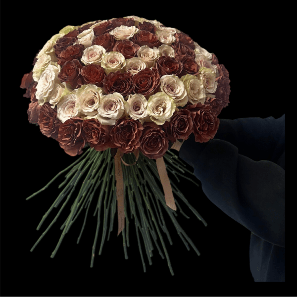 Round bouquet of cream and burgundy roses with long stems tied together