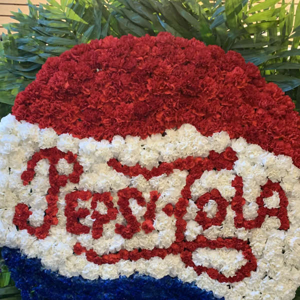 Red, white, and blue floral Pepsi logo display