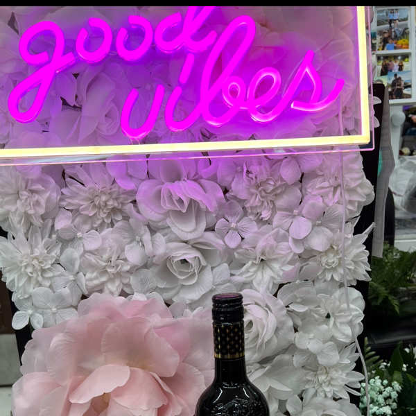 Mother's Day gift box with roses, chocolates, and a wine bottle