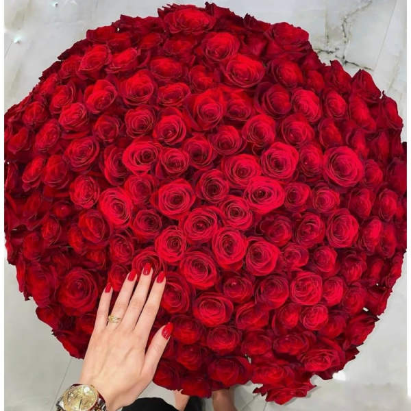 Large round bouquet of red roses viewed from above
