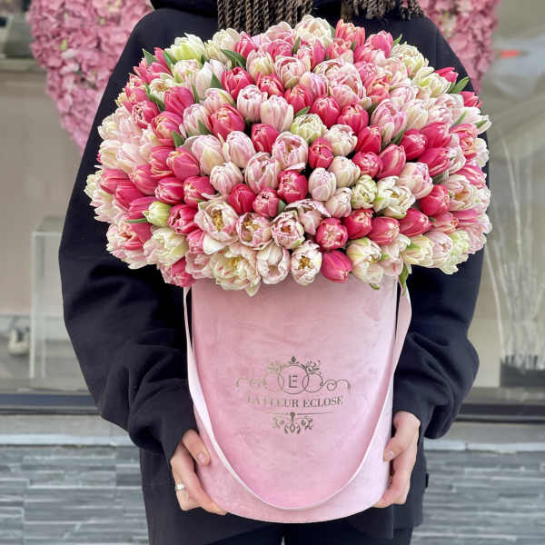 Large pink and white tulip bouquet in a pink hatbox