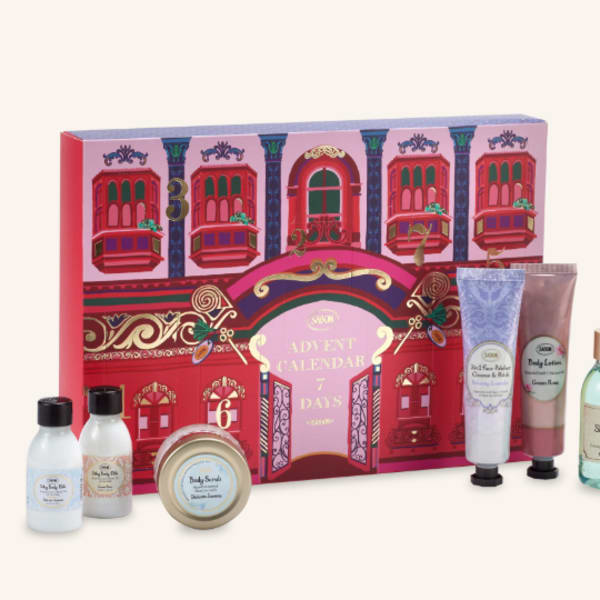 Advent calendar gift box with assorted bath and body products in bottles, tubes, and a tin