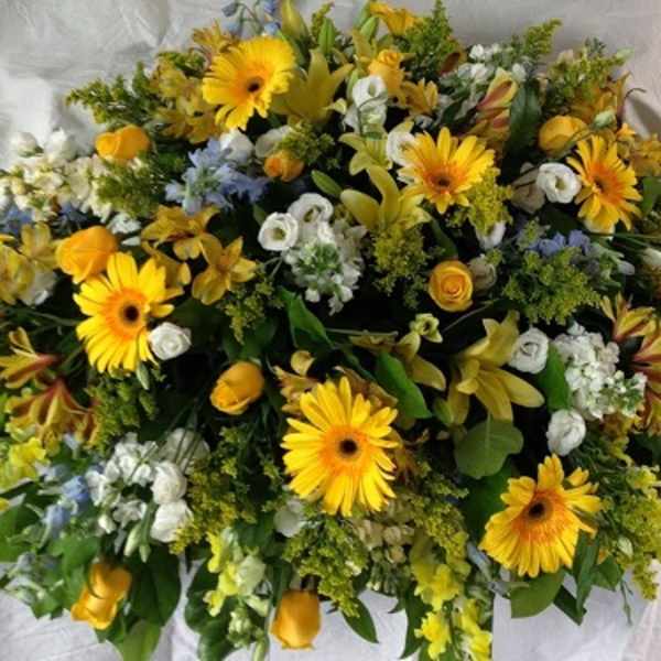 Large yellow and white floral spray with gerbera daisies and roses