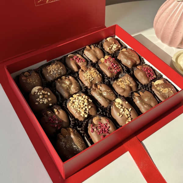 Box of chocolate-covered dates in a red gift box