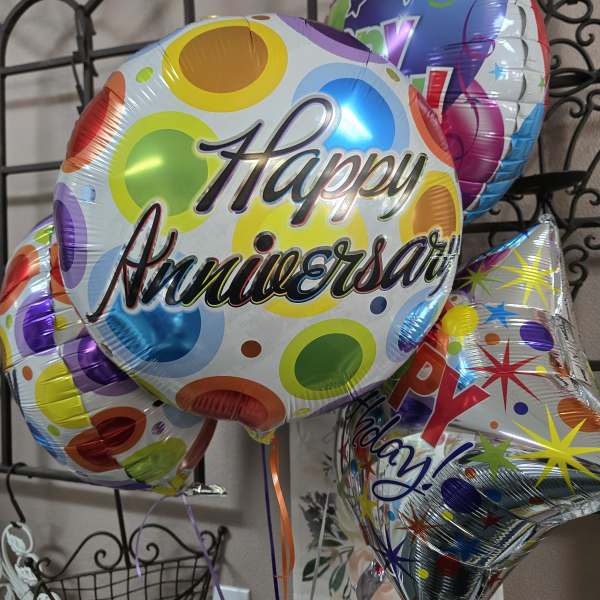 Colorful birthday balloons with "Happy Anniversary" text