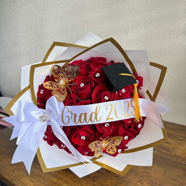 Red rose bouquet with a graduation cap and ribbon