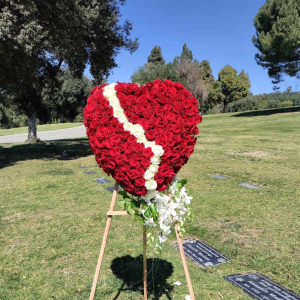 Heart-shaped rose standing spray with a white diagonal stripe