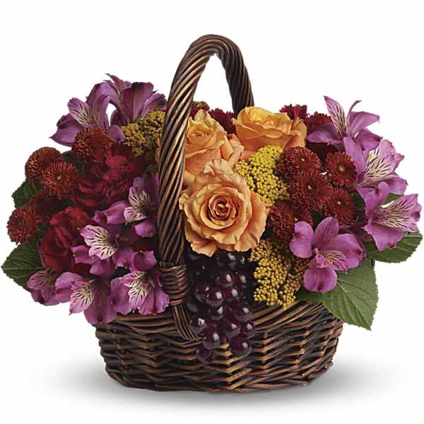 Basket of mixed flowers with roses and alstroemeria