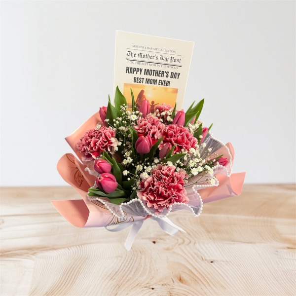 Pink carnation and tulip bouquet wrapped in pink paper with a Happy Mother's Day card