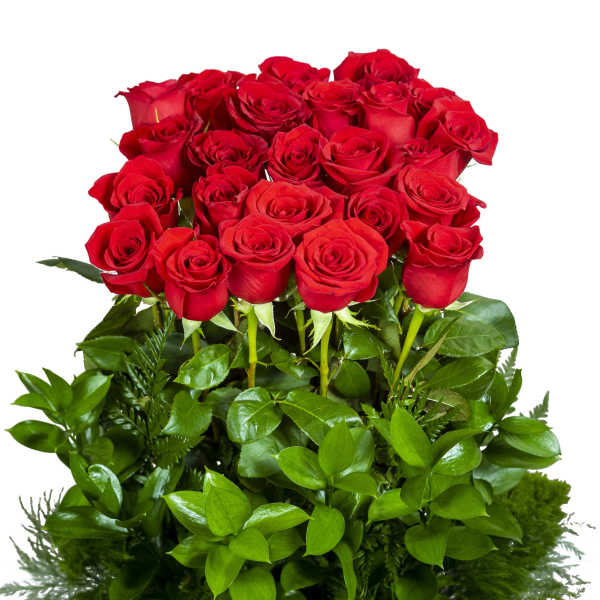 A bouquet of red roses with dense green foliage