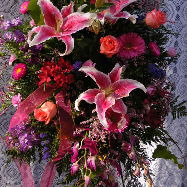Pink and white lily bouquet with roses and purple flowers