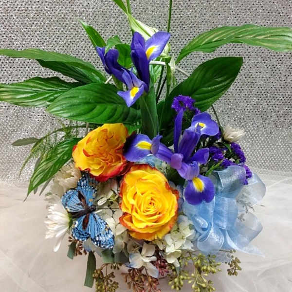 Bouquet with yellow roses, purple irises, and white peace lilies