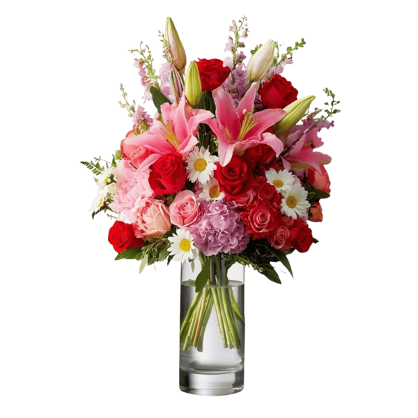 Mixed bouquet of pink lilies, red roses, and daisies in a clear glass vase
