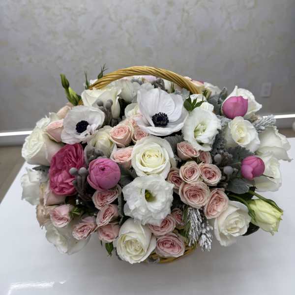 Basket of white and pink roses with white anemones