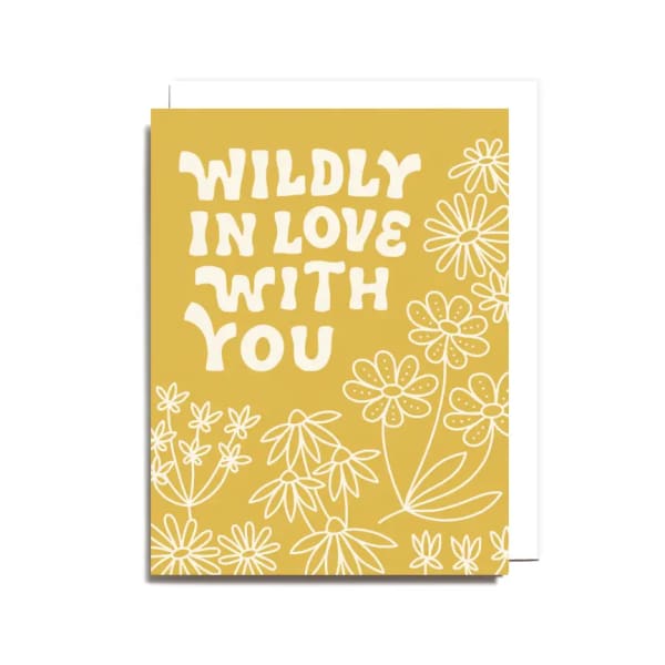 Yellow greeting card with white floral line art and the words "WILDLY IN LOVE WITH YOU"