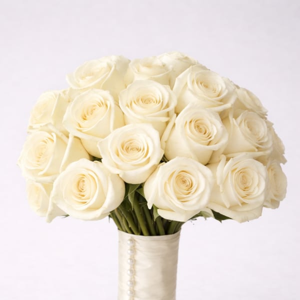 Bouquet of white roses with a satin ribbon handle