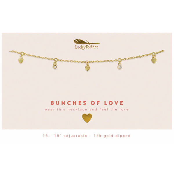 Gold charm necklace with small heart and crystal pendants on a cream card reading 'Bunches of Love'.