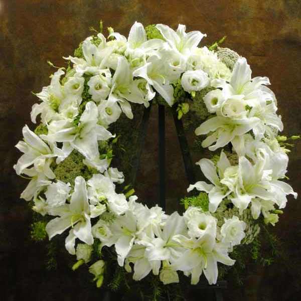 White floral wreath on a stand