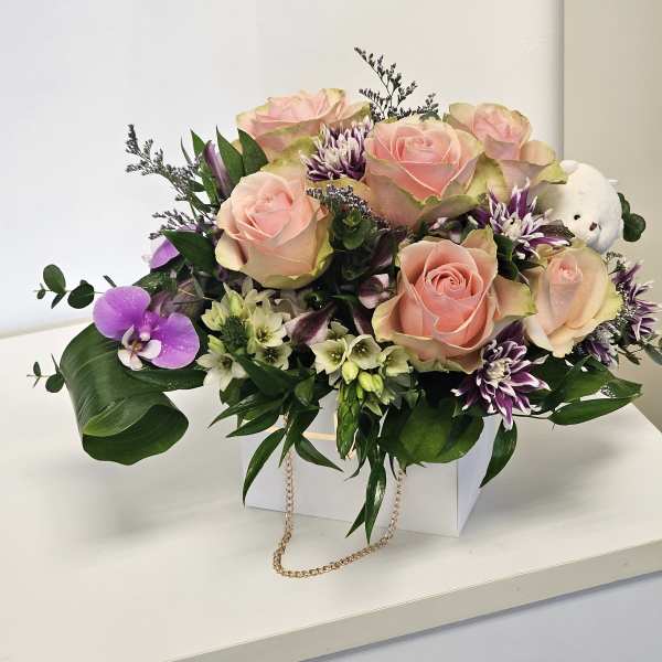 Beautiful arrangement with teddy bear