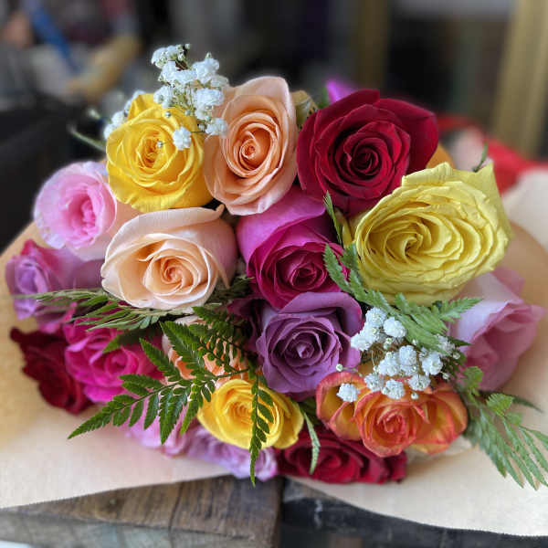 Bouquet of multicolored roses with baby's breath