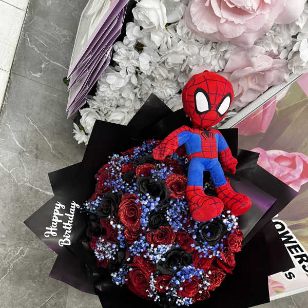 Spider-Man plush on a bouquet of red and black roses