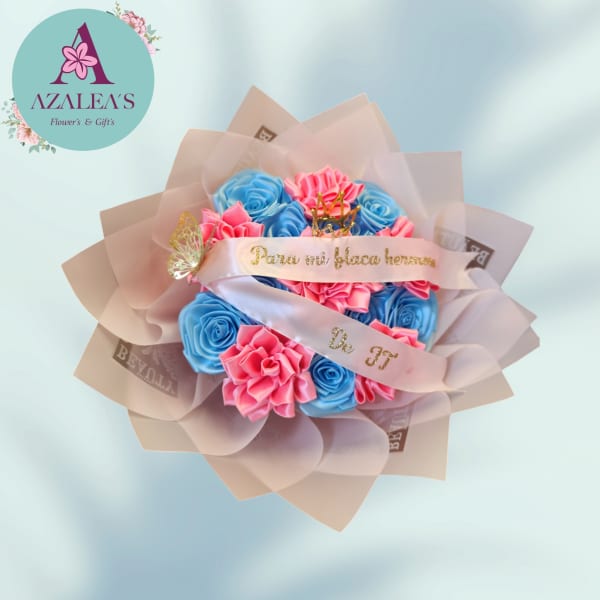 Bouquet of blue and pink roses wrapped in pale pink paper