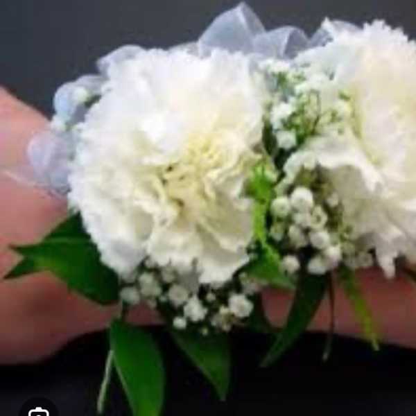 White carnation corsage with baby's breath and ribbon