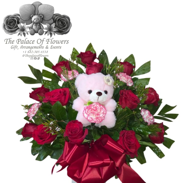 Bouquet of red roses with a pink teddy bear and satin ribbon