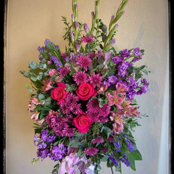 Tall standing floral spray with pink and purple flowers