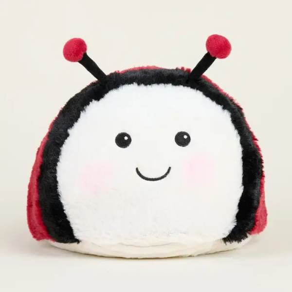 Plush ladybug toy with a smiling face and red-and-black body