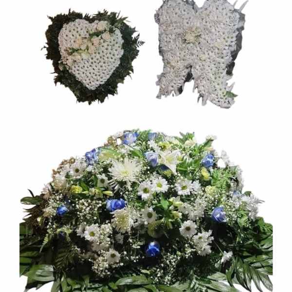 Three white floral funeral sprays, including two heart-shaped tributes and one casket spray