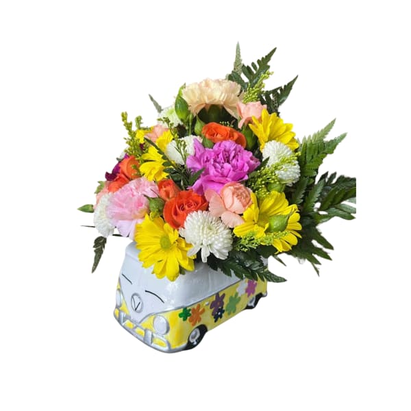 Colorful mixed flower arrangement in a painted van-shaped container