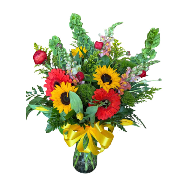 Bouquet of red and yellow gerbera daisies in a glass vase with a yellow ribbon
