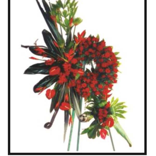 Red tropical floral arrangement with long dark leaves