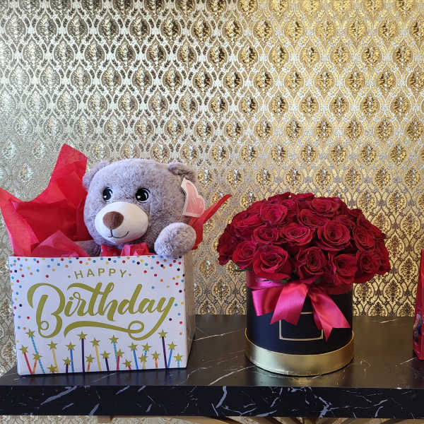 Birthday gift box with teddy bear, roses, and chocolates