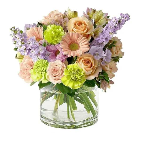 Mixed pastel bouquet in a clear glass vase