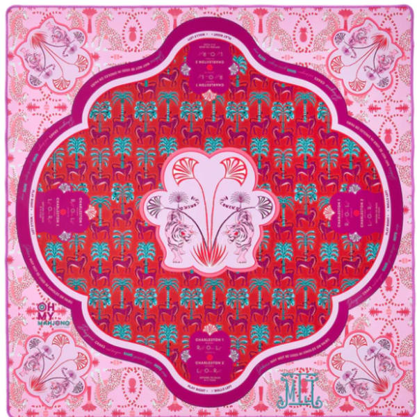 Decorative pink and red patterned scarf with ornate floral motifs