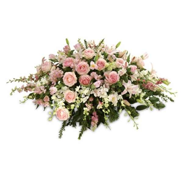 Low floral spray of pink roses and white lilies
