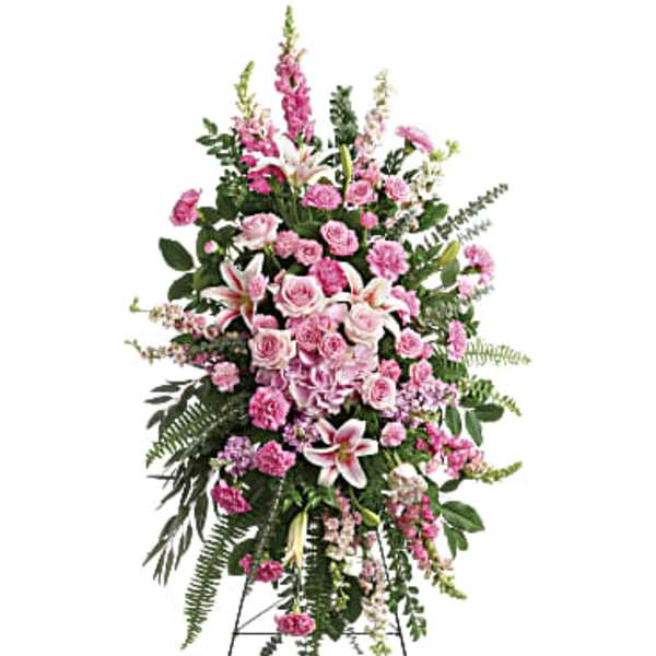 Tall pink floral standing spray on an easel