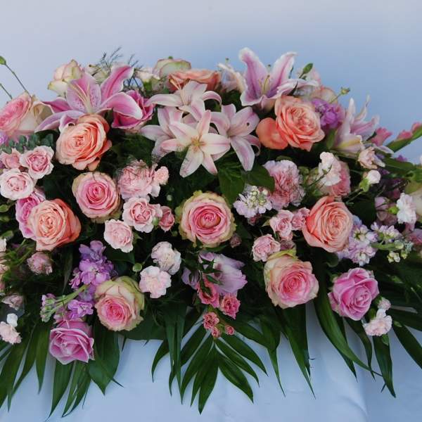 Large pink and peach floral spray with lilies and roses