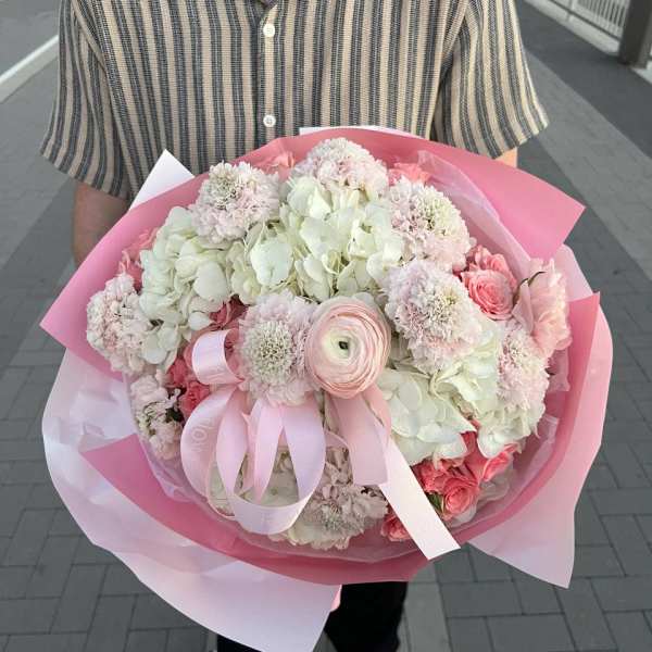 Large pink and white bouquet with hydrangeas, roses, and ribbon wrap