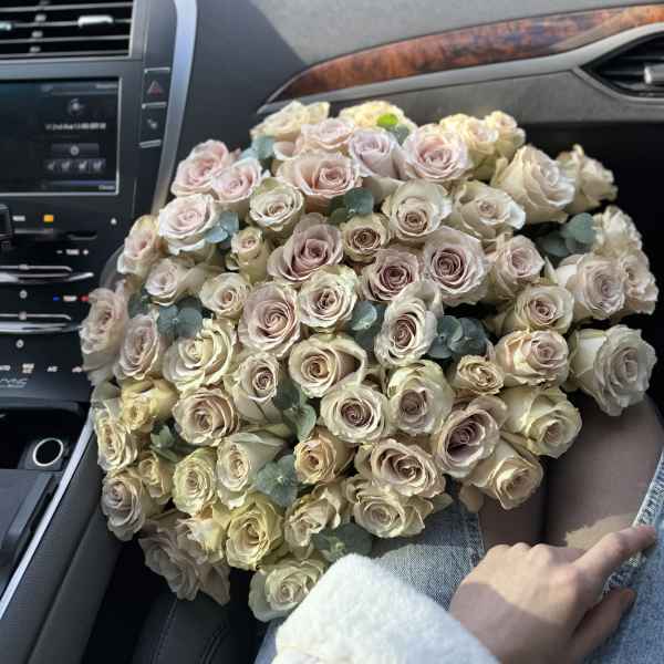 Unusual pink-purple roses with the addition of eucalyptus